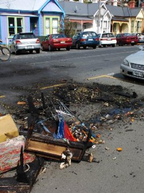 Debris from couch fires on Dundas St in October last year. Photo by ODT files