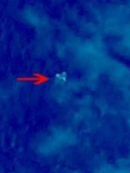 Debris from what could be Malaysian Airlines flight MH370 is seen in this satellite image from...