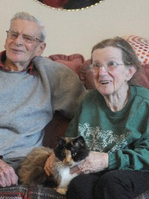 Dementia sufferer Bev and her husband, John, with Fluffy the cat. Photo by Peter McIntosh.