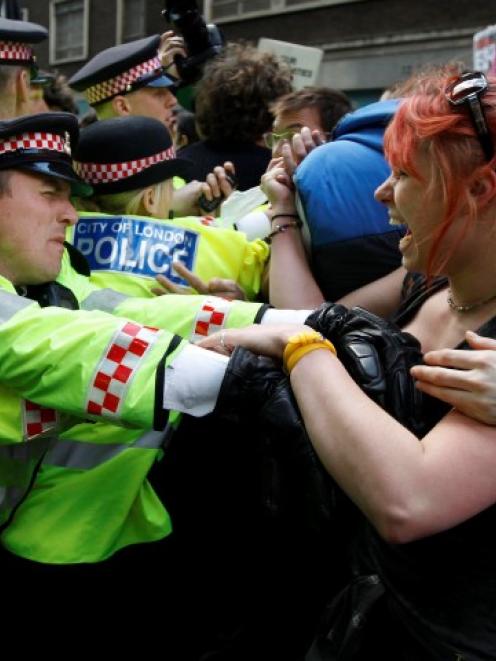 Demonstrators scuffle with police during a protest by the Occupy movement in London.  REUTERS...