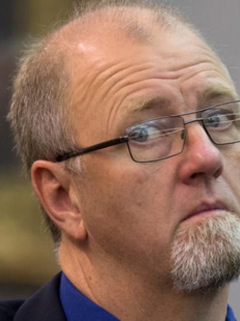 Denies killing his wife and daughter: Mark Lundy in court. Photo NZ Herald.