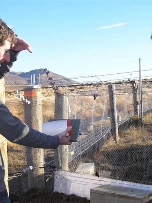 Department of Conservation ranger Phil Marsh (left) talks to Central Otago Ecological Trust...