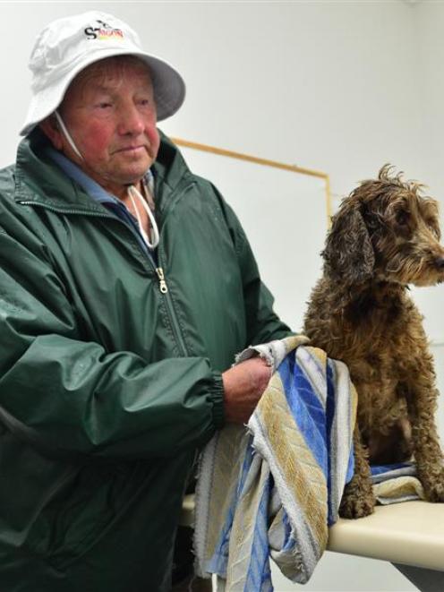 Derek Hovius dries Snoopy yesterday. Photo by Peter McIntosh.