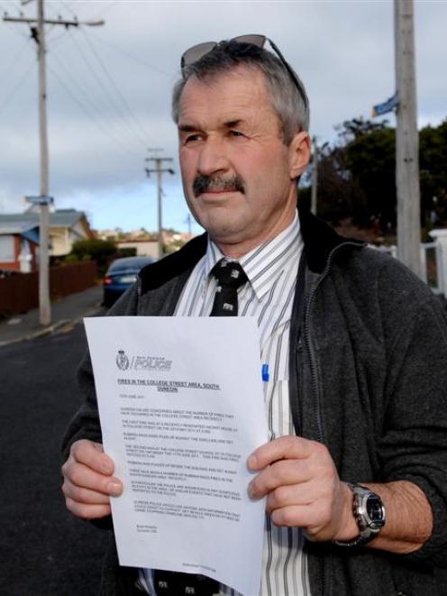 Detective Sergeant Brett Roberts, of Dunedin CIB, with a letter calling for information about...