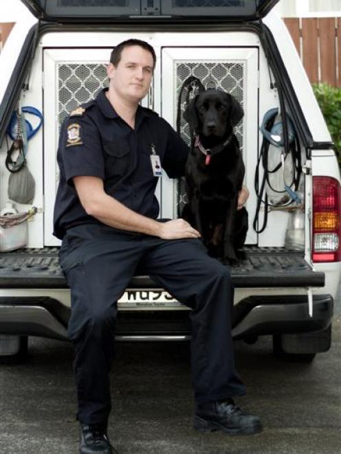 Detector dog Kane and his handler Senior Customs Officer Robert Gillanders. Photo by New Zealand...