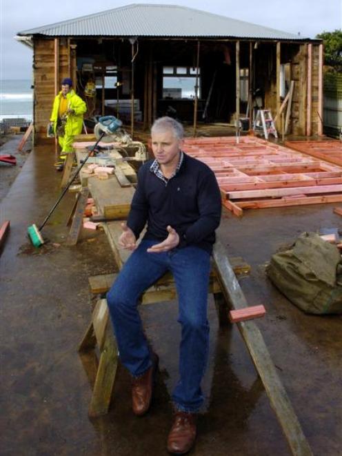Developer Stephen Chittock with workmen assembling wall framing for a new cafe and bar at the...