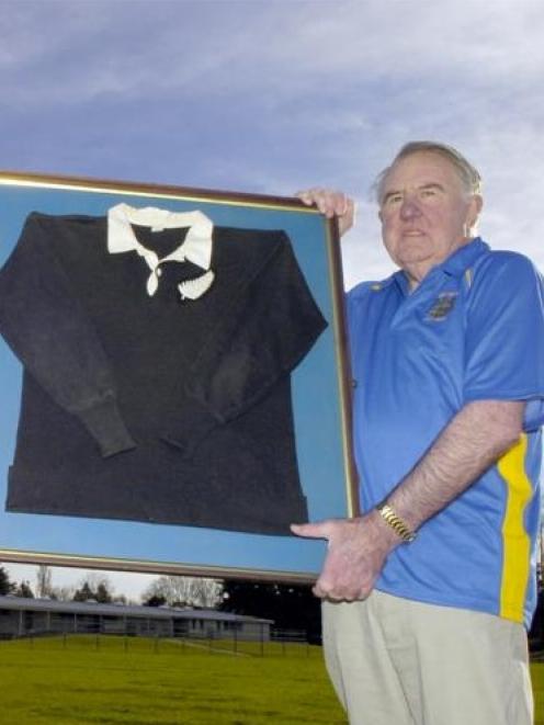 Former New Zealand Rugby Football Union president Dave Johnston shows off Peter Johnstone's All...