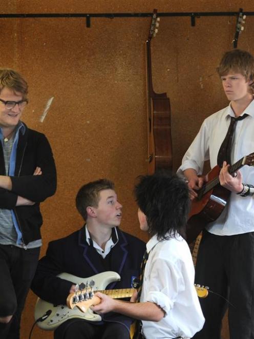 Die! Die! Die! lead singer Andrew Wilson offers advice to (from left) Toby Hartigan (15) and Dan...