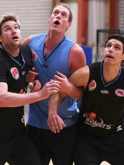 Dillon Boucher, Rick Rickert and Oscar Forman watch the ball during a New Zealand Breakers NBL...