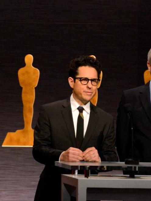 Directors JJ Abrams (L) and Alfonso Cuaron (R) announce the nominees for Best Picture during the...