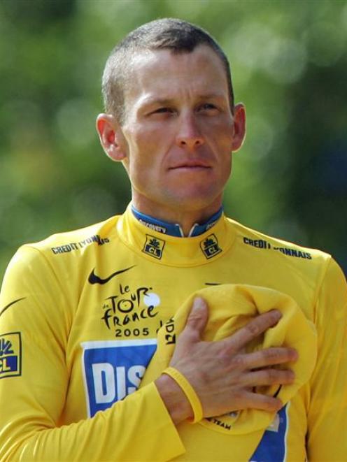 Discovery Channel team rider Lance Armstrong of the U.S. stands with hand on heart during the...