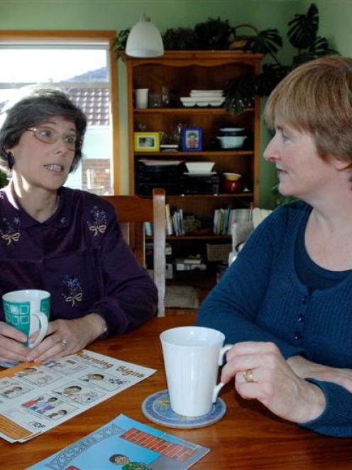 Discussing the benefits of vaccination for those with immunity disorders are Laura Hannah (left)...