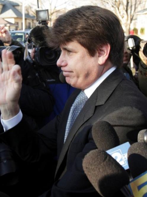 Disgraced former Illinois governor Rod Blagojevich leaves his Chicago home for the second day of...