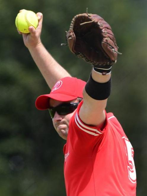 Dodgers pitcher Tom Snow rips in a pitch during his side's match against Saints, at Ellis Park on...