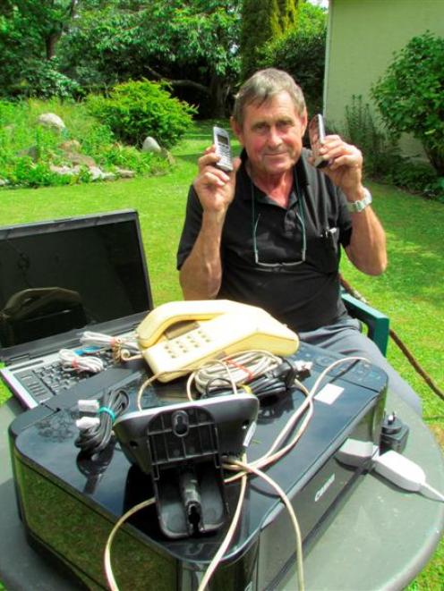 Don Sutherland, of Papakaio, with  the equipment damaged when his house was hit by lightning....