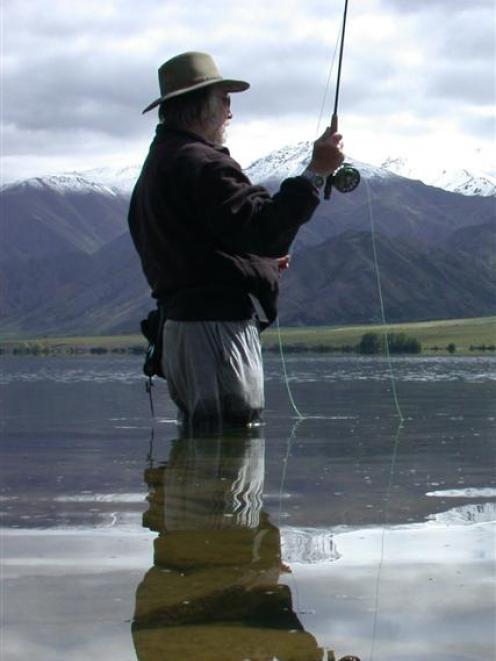 Donn Holmes, from Calgary, fishes Lake Benmore during his seventh trip to New Zealand. Photo by...