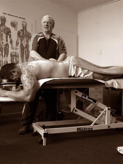 Donny Cameron works on the back of Otago prop Kees Meeuws. Photo by Gerard O'Brien.