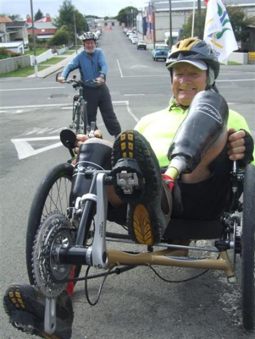 Double amputee John Nelson (front) is cycling around New Zealand, raising money and awareness for...