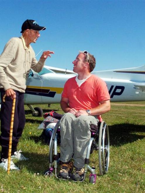 Doug Stewart critiques pilot Barry Cardno after their flight from Wanaka to the Taieri airfield....