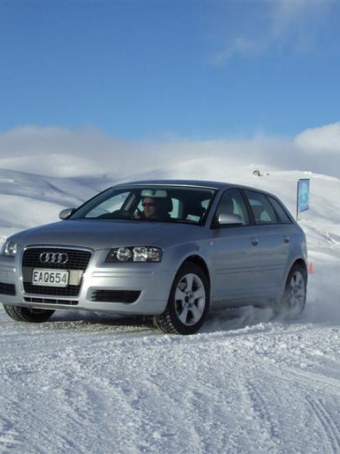 Downforce instructor Tim Martin slides an Audi RS4 expertly around a corner at the Ice Drive at...