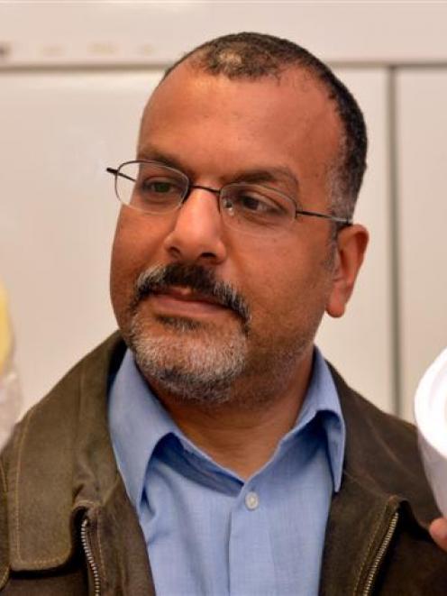Dr Alaa El-Din A Bekhit holds cheese made from the milk of a deer. Photo by Stephen Jaquiery.