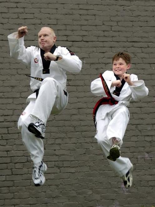 Dr Clive Dreyer and son William, of of Dowling Bay, near Aramoana, show off their taekwondo kicks...