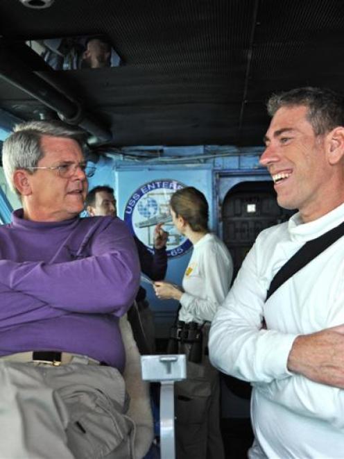 Dr Dave McKay (right) talks  to Captain William Hamilton on the  USS Enterprise bridge. Photo...