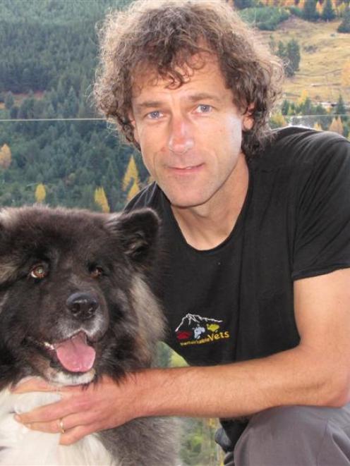 Dr Geoff Woodhouse, of Remarkable Vets Arrowtown, with Gypsy, the 3-year-old Japanese Akita dog...