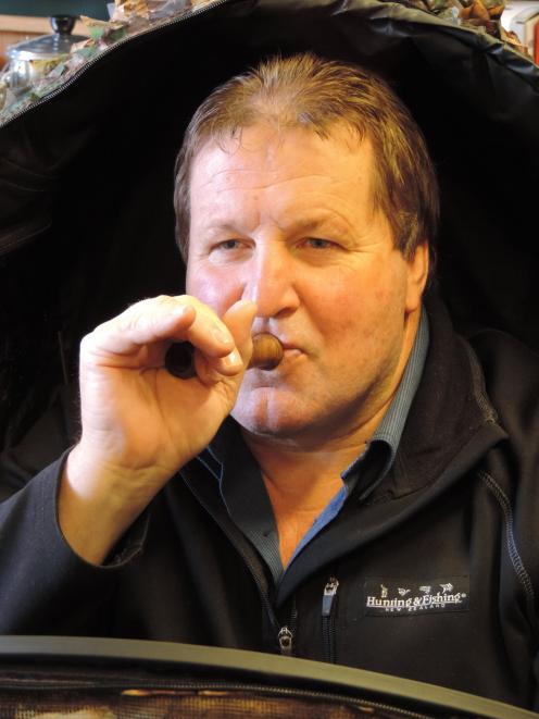 Duck-shooter Quinny  tries out a duck-caller in the lead-up to a national duck-calling...