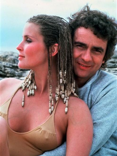 Dudley Moore embraces actress Bo Derek during the filming of "10," directed by Blake Edwards. (AP...