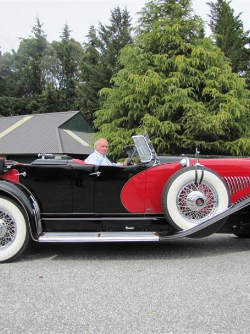 Duesenberg ''caretaker'' Robert Duncan at the wheel of the latest addition to the collection at...