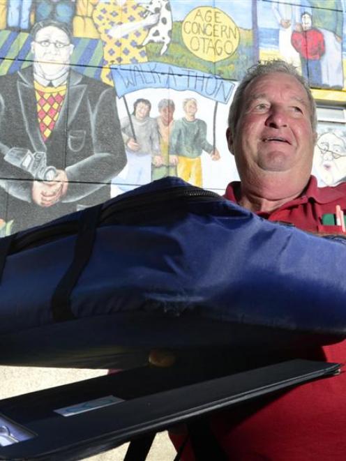 Duncan Whyte, of Dunedin, prepares to deliver meals  in Dunedin yesterday. Photo by Peter McIntosh.