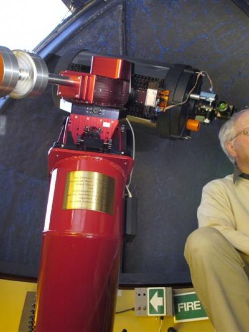 Dunedin Astronomical Society committee member Ash Pennell with a modern, computer-guided...