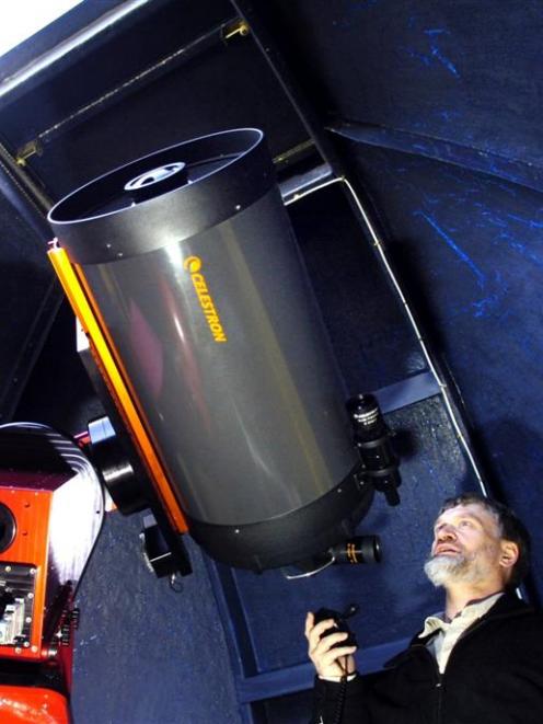 Dunedin Astronomical Society president Peter Jaquiery with a $34,000 telescope and mount...