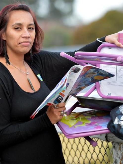 Dunedin beneficiary Axelina Pokipoki with a Home Direct brochure and products which increased her...