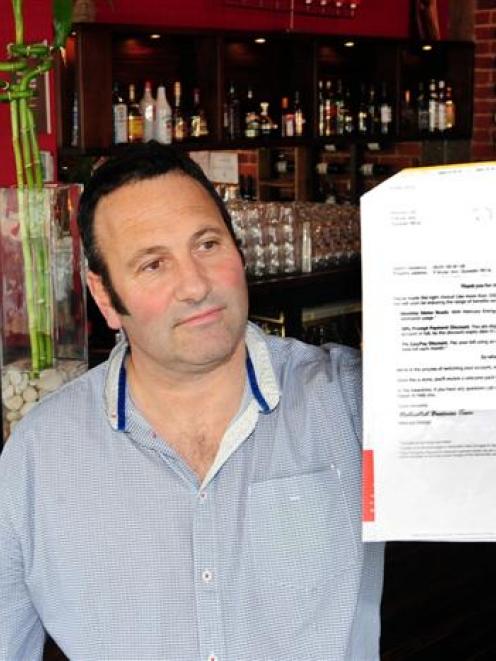 Dunedin businessman Steve Wilson, the owner of Ironic Cafe and Bar, holds his letter of...