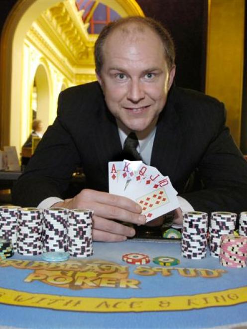 Dunedin Casino gaming manager Marc Yeoman reveals the royal flush which won a Dunedin grandmother...