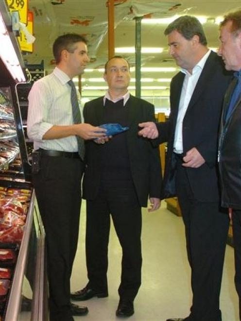 Dunedin Centre City New World store manager Justin Vaundrey discusses lamb display with...
