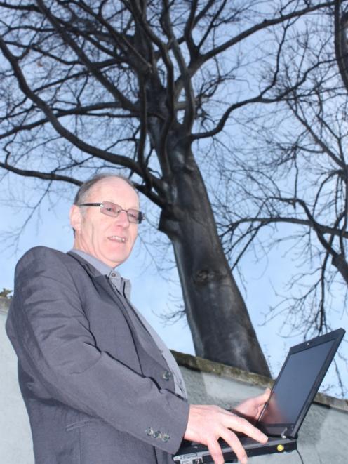 Dunedin City Council landscape architect Barry Knox inspects a  lime tree  in  York Pl as part of...