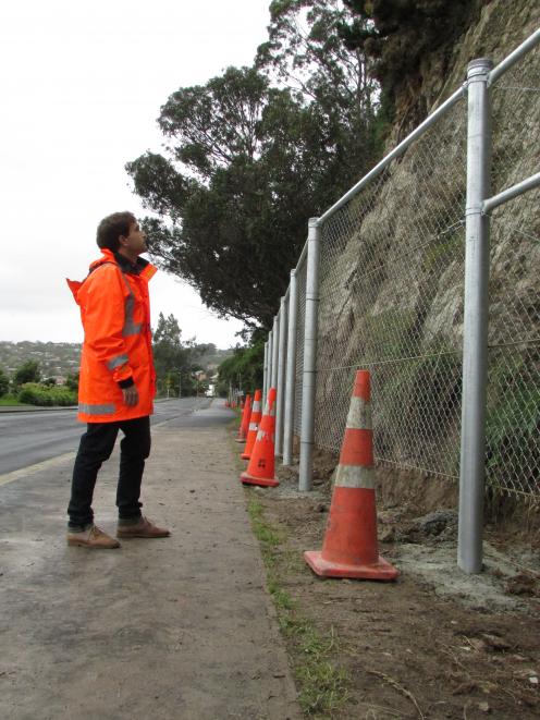 Dunedin City Council senior contract engineer Chris Hasler checks  the cliff wall in  Shore St,...