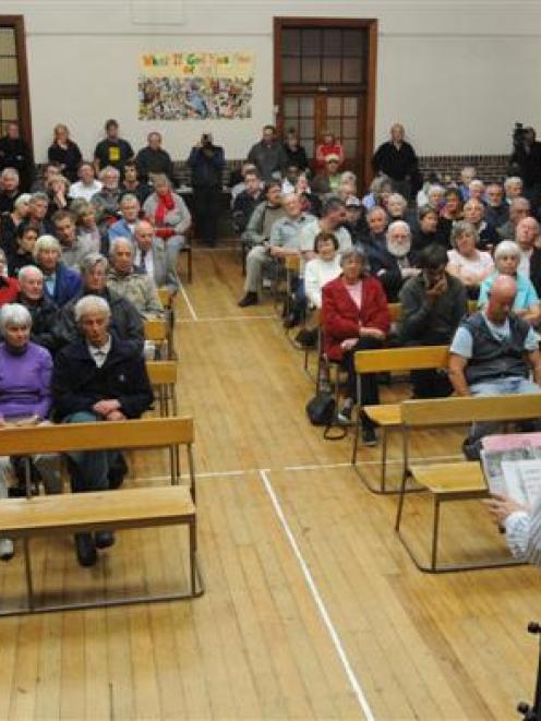 Dunedin city councillor Neil Collins speaks at the Stop the Stadium meeting at the Caversham...
