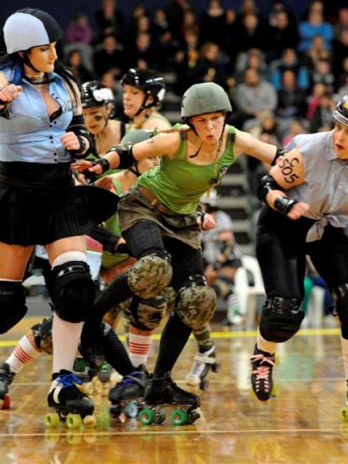 Dunedin Derby roller-skaters (from left) Sam Mitchell (Anne Thrax), Bronwyn Clarke (Sister...
