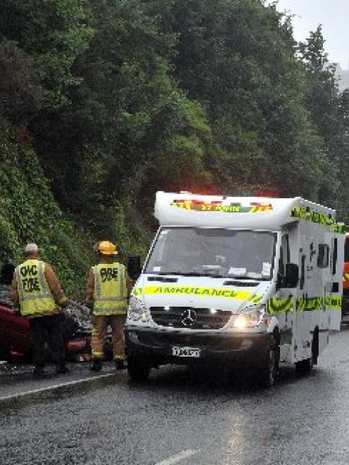 Dunedin emergency services attend a car roll-over in Pitt St about 11.20am yesterday. Photo by...