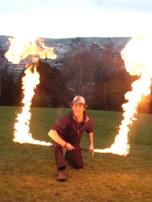 Dunedin fire performer Logan Elliott warms up yesterday for his big trip. Photo by Jane Dawber.