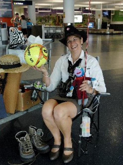 Dunedin International Airport customer services officer Clare  Doherty sits yesterday with some...