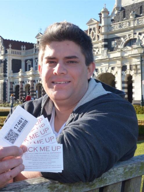 Dunedin man Dan Faulknor with his ''Little cards'', a social experiment where the card numbers...