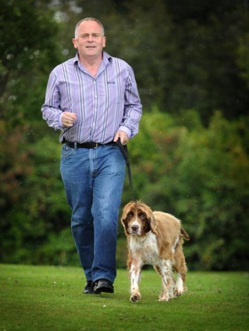 Dunedin man Ricky Collins with his springer spaniel, Jake. Photo by Gerard O'Brien.