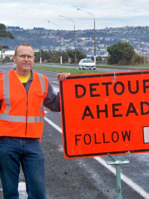 Dunedin marathon traffic manager Ian McDonald mans a detour sign on Portsmouth Dr. Photo by Wayne...