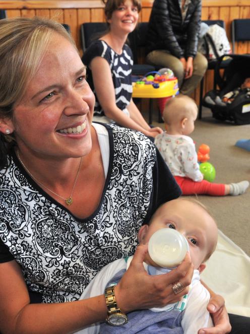 Dunedin mother Brydie Archbold feeds her baby Flyn his bottle. Photo by Linda Robertson.