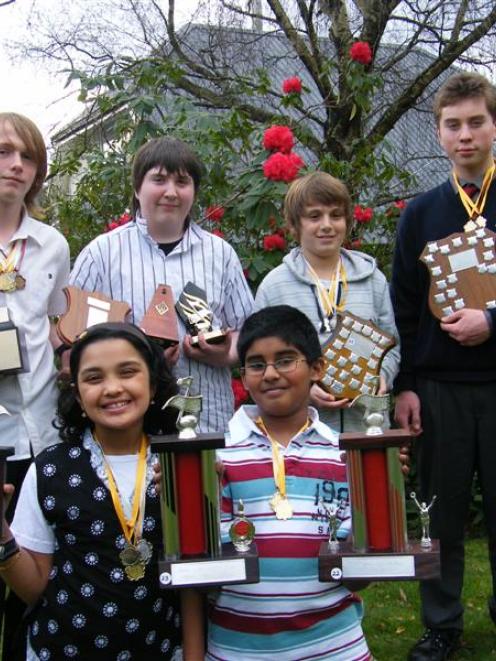 Dunedin NZ Modern School of Music pupils display the impressive haul of trophies they won at the...